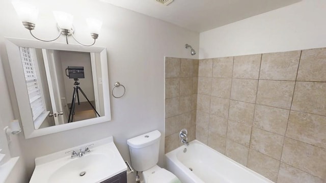 full bathroom featuring visible vents, shower / bath combination, vanity, and toilet