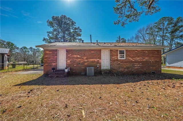 821 Charles Cir, Griffin, GA 30224 - back of house with brick siding and central air condition unit
