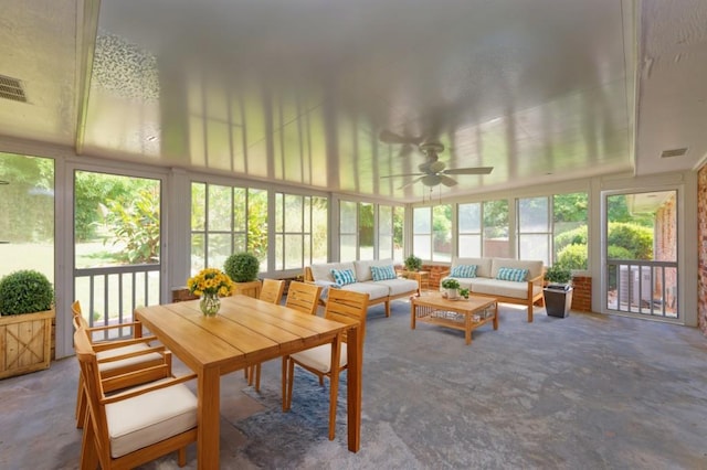 sunroom / solarium featuring a ceiling fan and visible vents