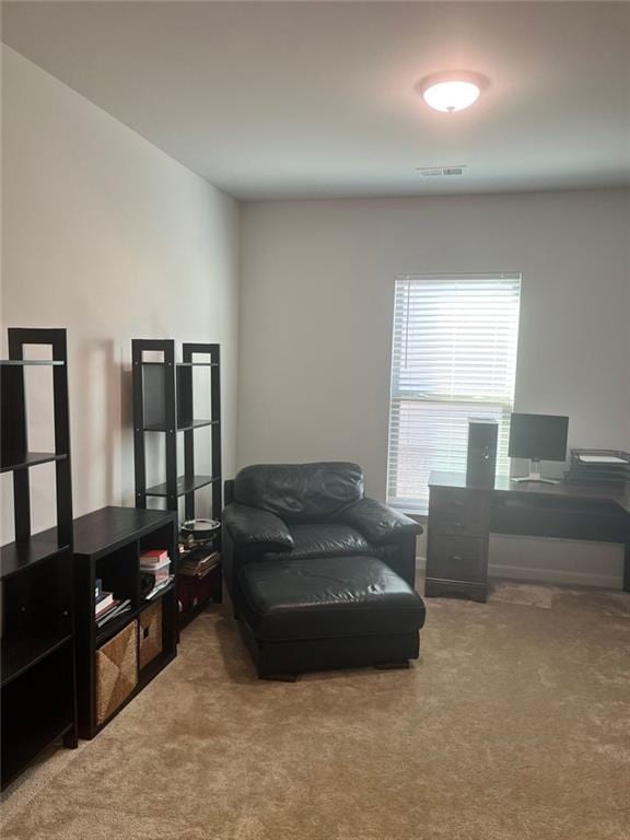 sitting room with carpet floors and visible vents