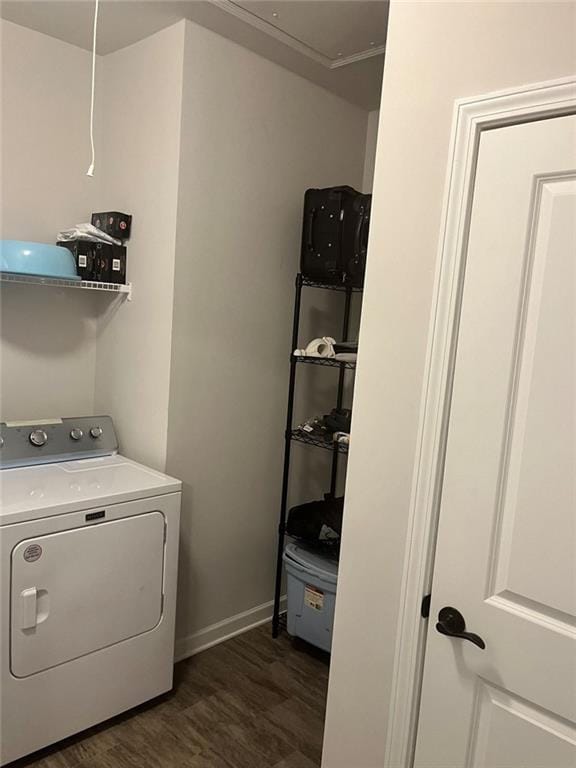 washroom featuring laundry area, dark wood-style flooring, baseboards, and washer / dryer