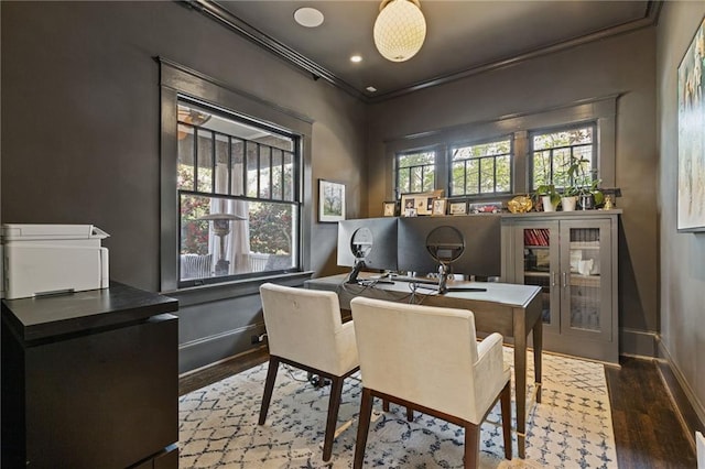 office featuring crown molding, wood finished floors, and baseboards