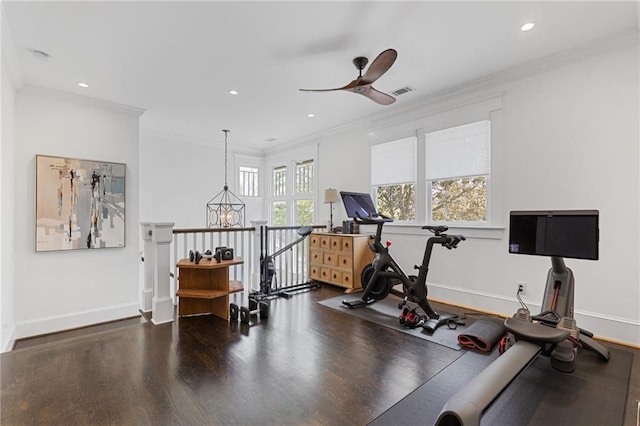 workout room featuring baseboards, wood finished floors, ceiling fan, and crown molding