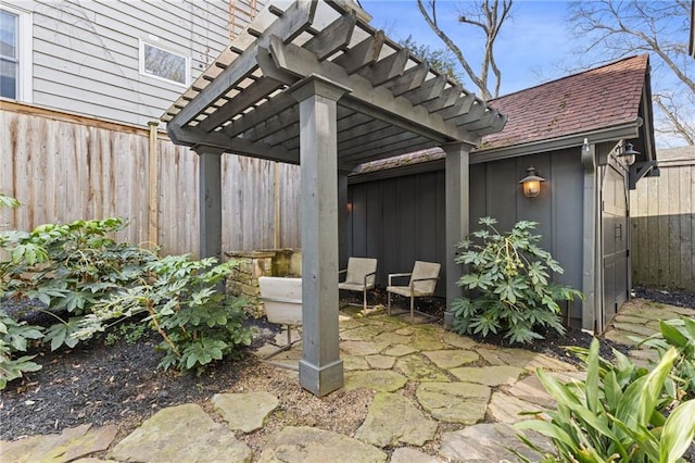 view of patio featuring fence and a pergola