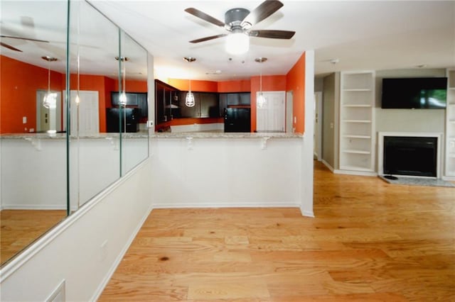 485 Sherman Way, Decatur, GA 30033 - kitchen with ceiling fan, fridge, a peninsula, and light wood-style flooring