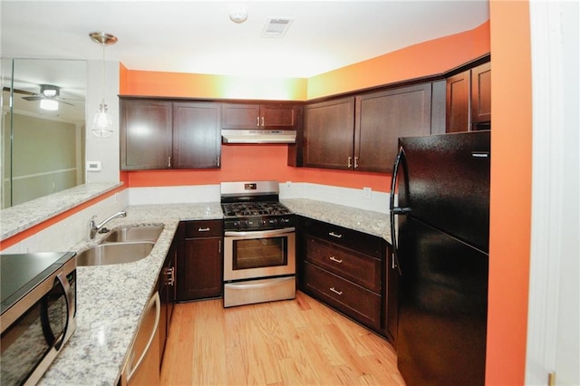 485 Sherman Way, Decatur, GA 30033 - kitchen with stainless steel appliances, under cabinet range hood, a sink, light wood-type flooring, and a ceiling fan
