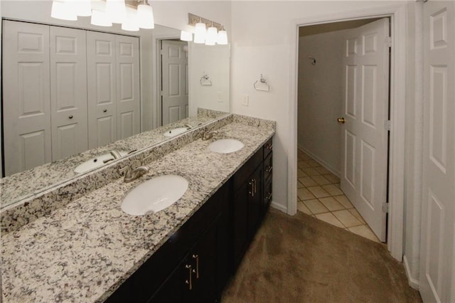 485 Sherman Way, Decatur, GA 30033 - bathroom featuring double vanity, tile patterned floors, and baseboards