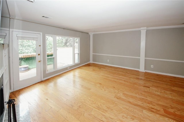 485 Sherman Way, Decatur, GA 30033 - spare room featuring light wood-style flooring, baseboards, and ornamental molding