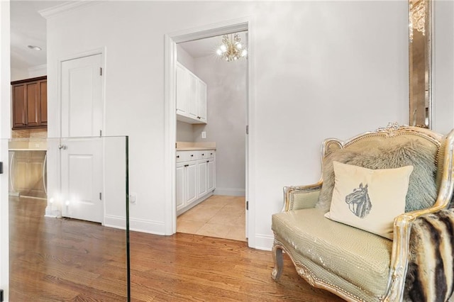 538 Sarabrook Pl NE, Sandy Springs, GA 30342 - living area with light wood-style floors, baseboards, and ornamental molding