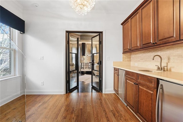 538 Sarabrook Pl NE, Sandy Springs, GA 30342 - bar with fridge, a sink, dark wood finished floors, tasteful backsplash, and baseboards