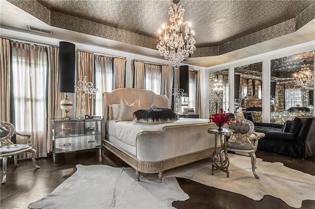 538 Sarabrook Pl NE, Sandy Springs, GA 30342 - bedroom featuring a chandelier, a raised ceiling, multiple windows, and wood finished floors