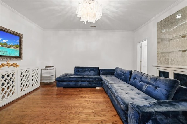 538 Sarabrook Pl NE, Sandy Springs, GA 30342 - living area featuring a chandelier, ornamental molding, and wood finished floors