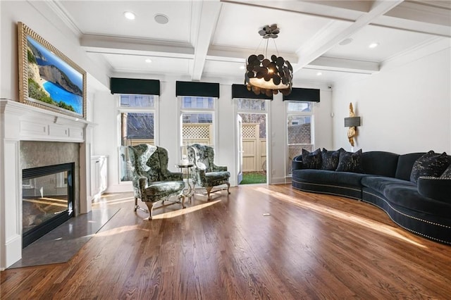538 Sarabrook Pl NE, Sandy Springs, GA 30342 - living room featuring wood finished floors, coffered ceiling, a fireplace, beamed ceiling, and a chandelier