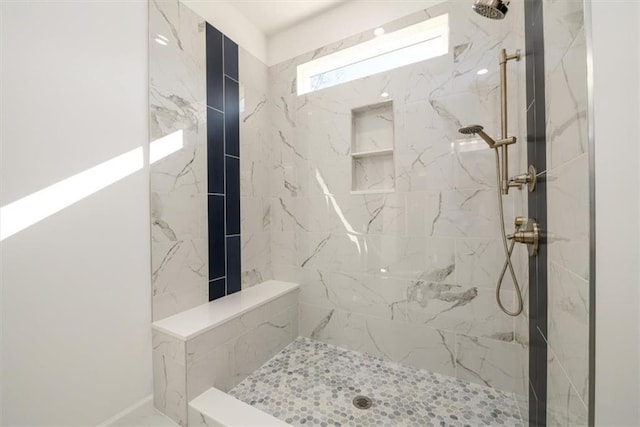 bathroom featuring tiled shower