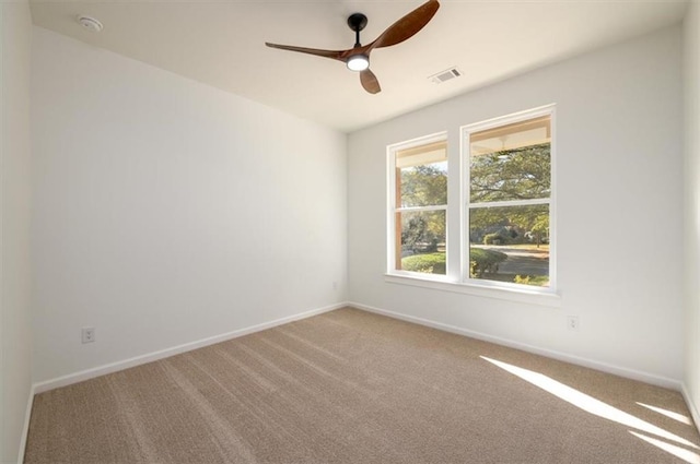 unfurnished room featuring carpet flooring and ceiling fan