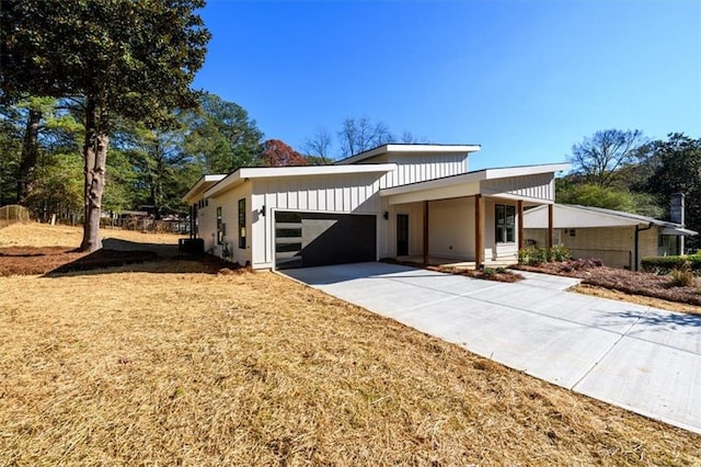 view of front of house with a garage and a front lawn