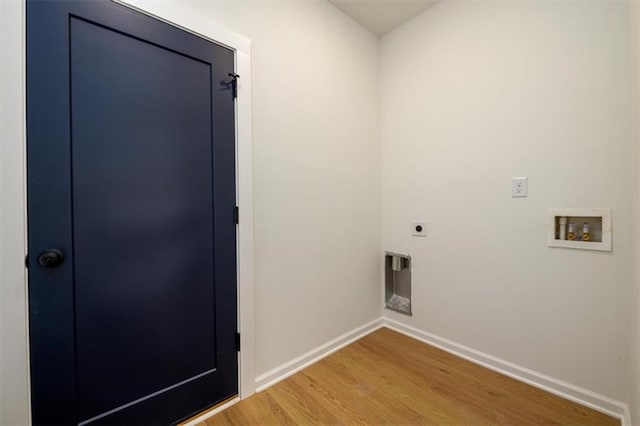 washroom with washer hookup, hookup for an electric dryer, and wood-type flooring