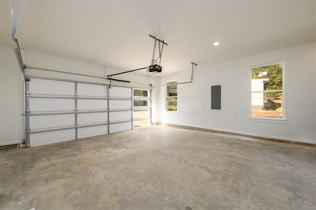 garage with electric panel and a garage door opener