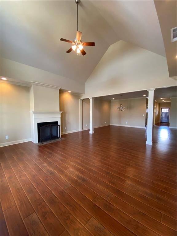 unfurnished living room featuring ceiling fan, dark wood-type flooring, and high vaulted ceiling