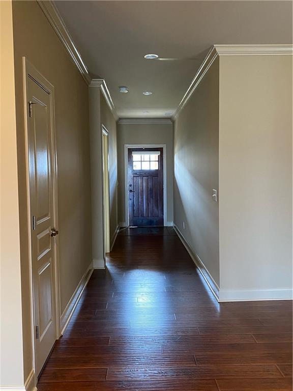 unfurnished living room with high vaulted ceiling, ceiling fan, and dark wood-type flooring