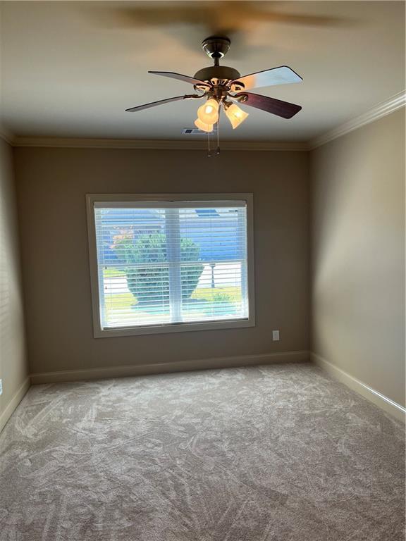 kitchen with hardwood / wood-style flooring, light stone counters, and appliances with stainless steel finishes