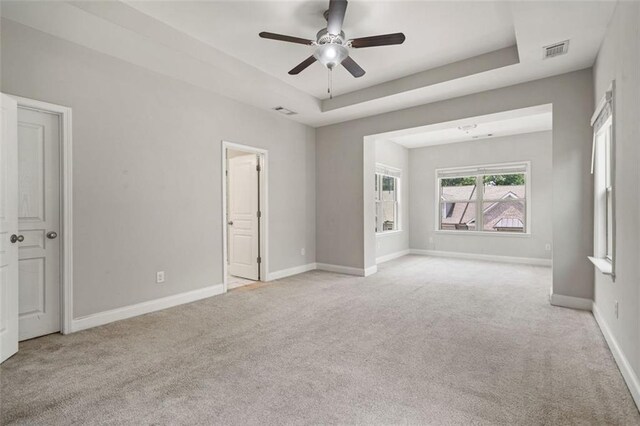 1463 Edgebrook Ct NE Unit 14, Atlanta, GA 30329 - empty room featuring light colored carpet, ceiling fan, baseboards, and a raised ceiling