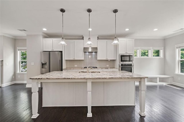 1463 Edgebrook Ct NE Unit 14, Atlanta, GA 30329 - kitchen with appliances with stainless steel finishes, under cabinet range hood, a sink, a center island with sink, and dark wood-style floors