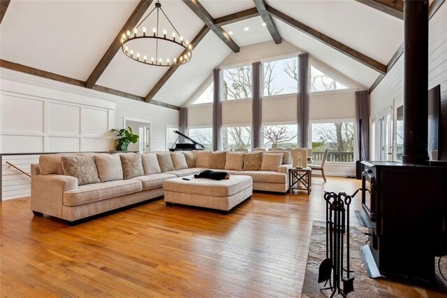 2600 Ramsey Rd, Gainesville, GA 30501 - living room with beam ceiling, a chandelier, hardwood / wood-style floors, and high vaulted ceiling