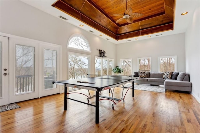 2600 Ramsey Rd, Gainesville, GA 30501 - recreation room featuring ceiling fan, a high ceiling, a tray ceiling, light hardwood / wood-style floors, and wooden ceiling