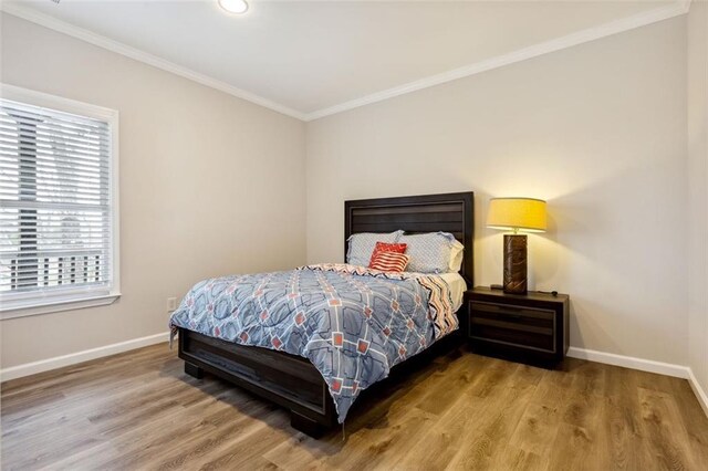 2600 Ramsey Rd, Gainesville, GA 30501 - bedroom with hardwood / wood-style flooring and ornamental molding