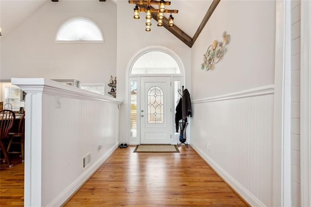 2600 Ramsey Rd, Gainesville, GA 30501 - foyer entrance with beamed ceiling, wood-type flooring, a wealth of natural light, and high vaulted ceiling