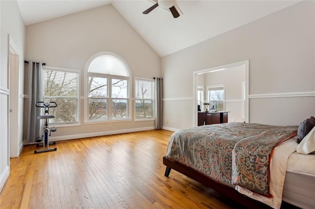 2600 Ramsey Rd, Gainesville, GA 30501 - bedroom featuring multiple windows, ceiling fan, high vaulted ceiling, and light wood-type flooring