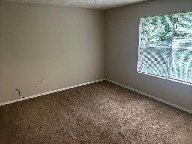 4963 Windsor Downs Ln, Decatur, GA 30035 - carpeted spare room featuring baseboards