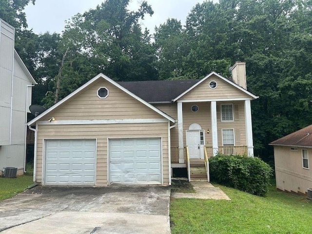 4963 Windsor Downs Ln, Decatur, GA 30035 - view of front of property with a chimney, a garage, driveway, central AC unit, and a front yard