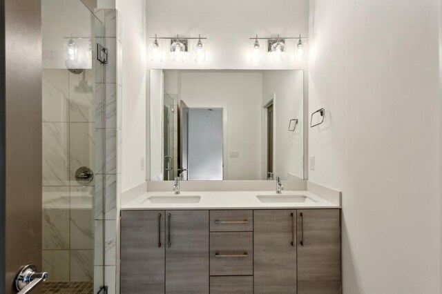 bathroom featuring vanity and an enclosed shower