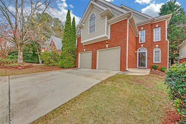 view of front of house featuring a garage and a front yard