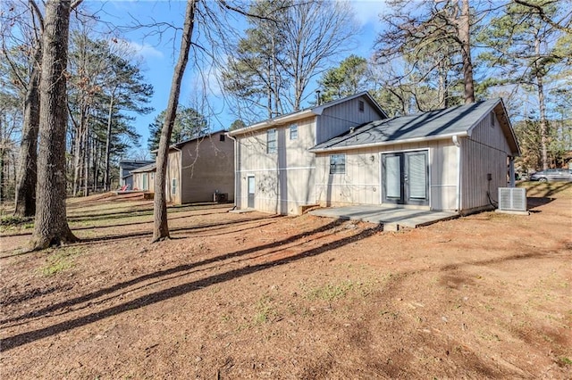 back of house with central air condition unit, french doors, and a patio