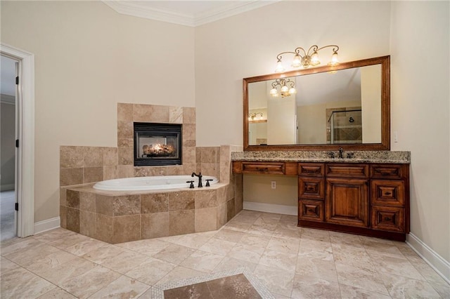 bathroom with ornamental molding, a tile fireplace, vanity, and tiled tub