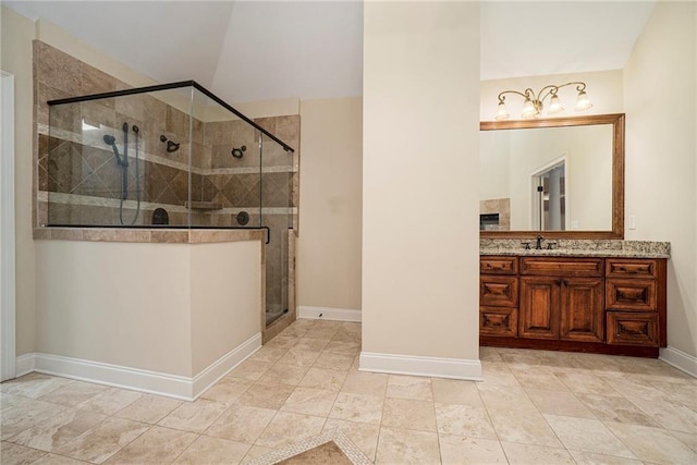 bathroom with vanity, an enclosed shower, and vaulted ceiling