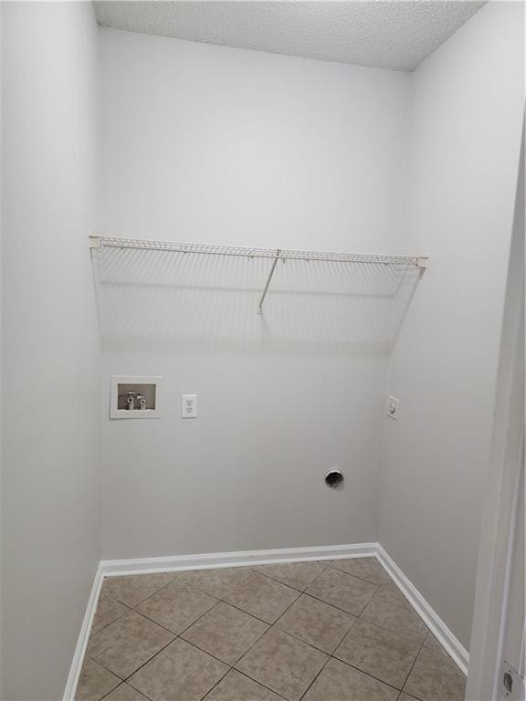 washroom featuring electric dryer hookup, laundry area, washer hookup, and a textured ceiling