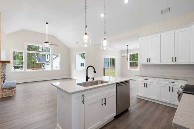 150 Doris Path, Dallas, GA 30157 - kitchen featuring stainless steel appliances, a sink, dark wood-style flooring, vaulted ceiling, and white cabinets