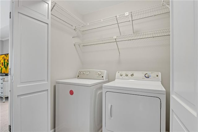 laundry room featuring laundry area and washing machine and clothes dryer