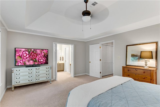 bedroom featuring a tray ceiling, visible vents, ornamental molding, light carpet, and baseboards