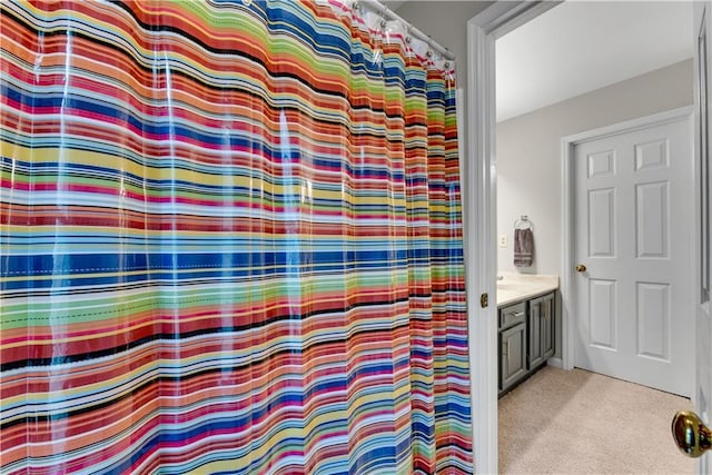 bathroom with vanity and a shower with shower curtain