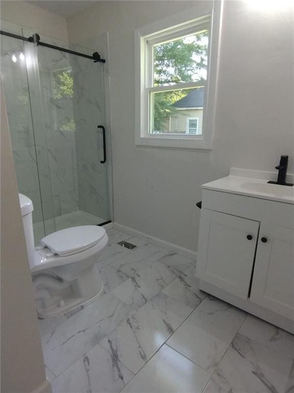 747 Bowman St, Macon, GA 31217 - full bath featuring vanity, a marble finish shower, and marble finish flooring