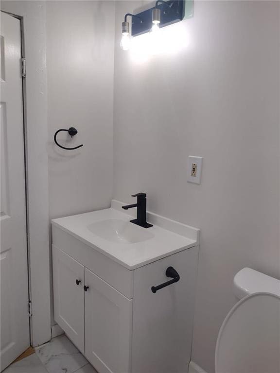 747 Bowman St, Macon, GA 31217 - half bath with vanity and marble look tile flooring