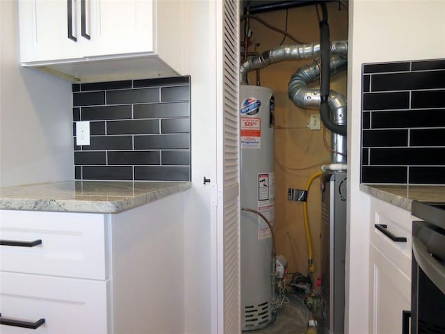 utility room with gas water heater