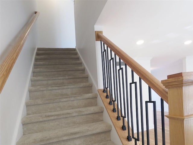 staircase with wood-type flooring