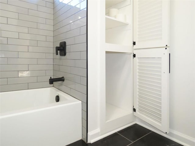 bathroom with tile patterned flooring and tiled shower / bath combo