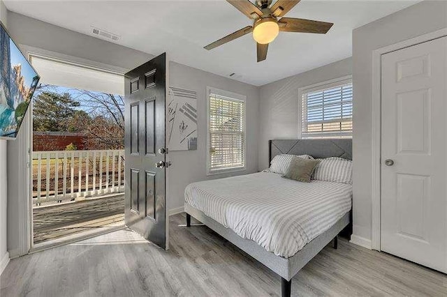 bedroom featuring light wood-type flooring and ceiling fan